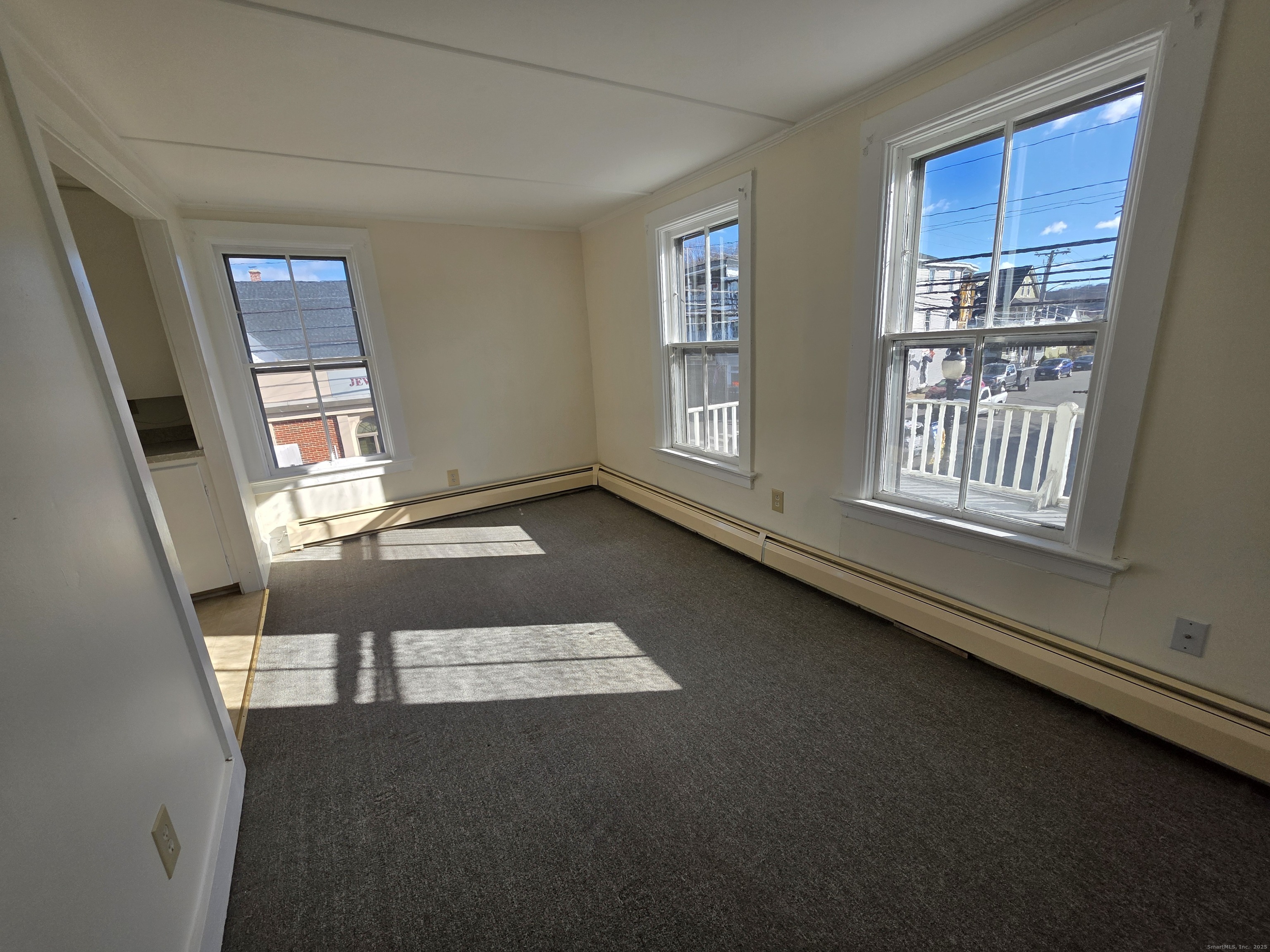 110 Main Street Griswold, CT 06351 - Photo 22 of 32 an empty room with windows