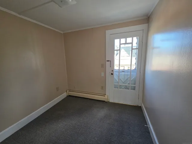 an empty room with windows and closet
