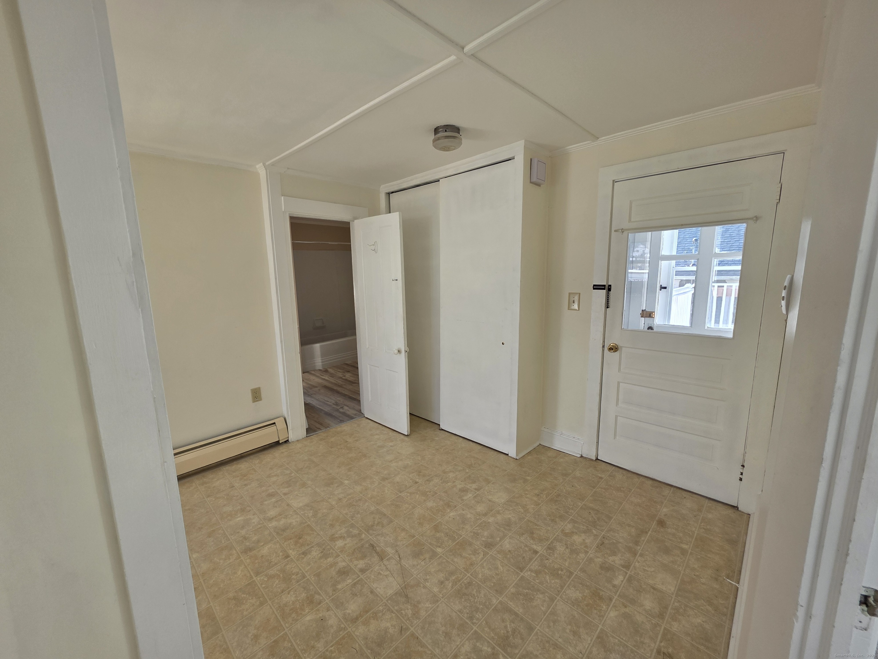 110 Main Street Griswold, CT 06351 - Photo 28 of 32 an empty room with windows and closet