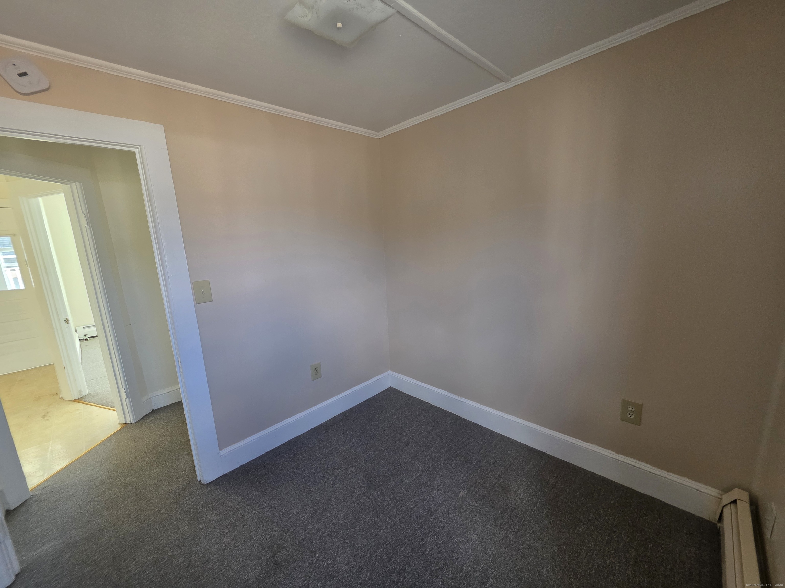 110 Main Street Griswold, CT 06351 - Photo 30 of 32 an empty room with windows