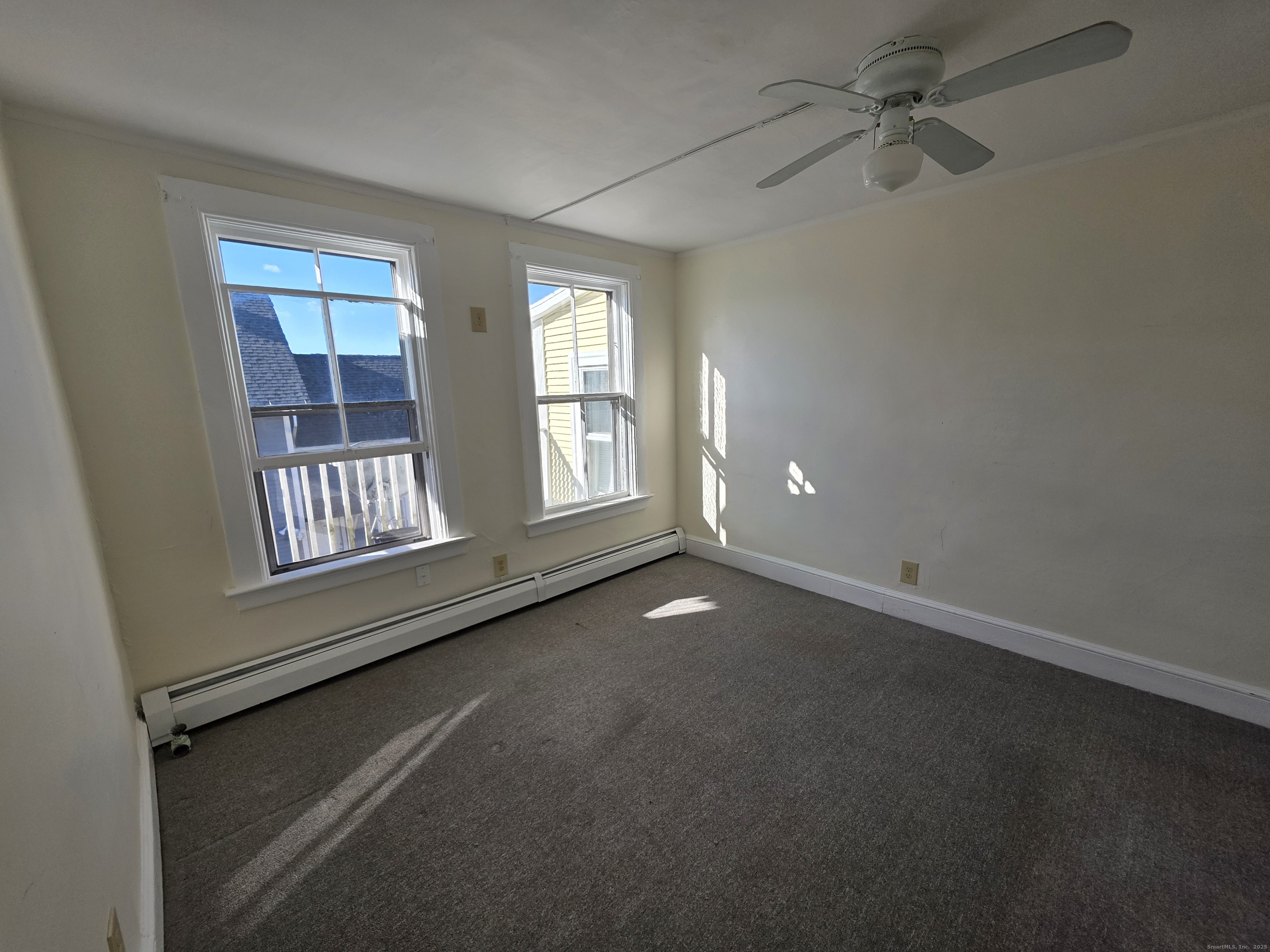 110 Main Street Griswold, CT 06351 - Photo 5 of 32 a view of an empty room with a window