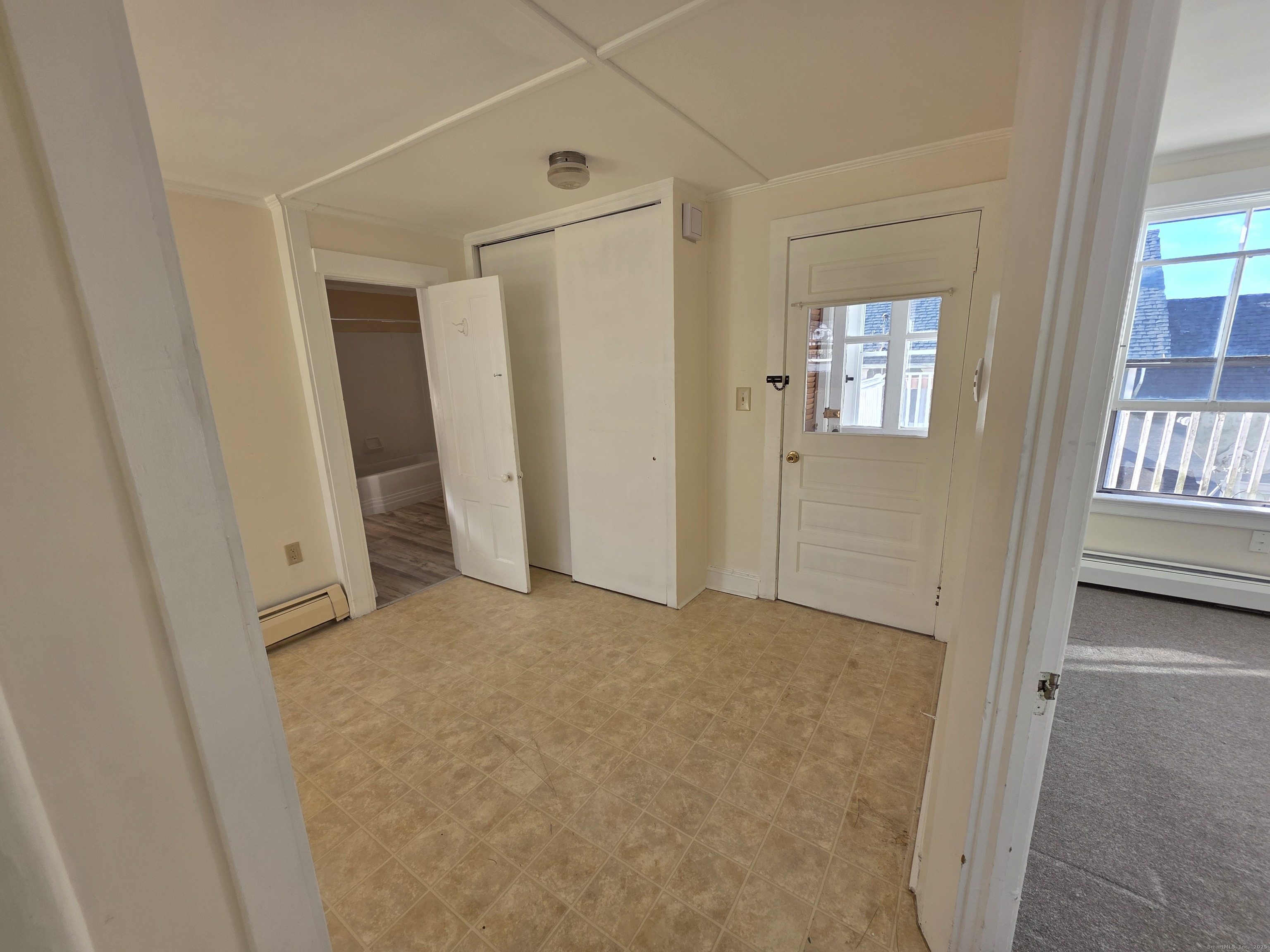 110 Main Street Griswold, CT 06351 - Photo 6 of 32 an empty room with windows