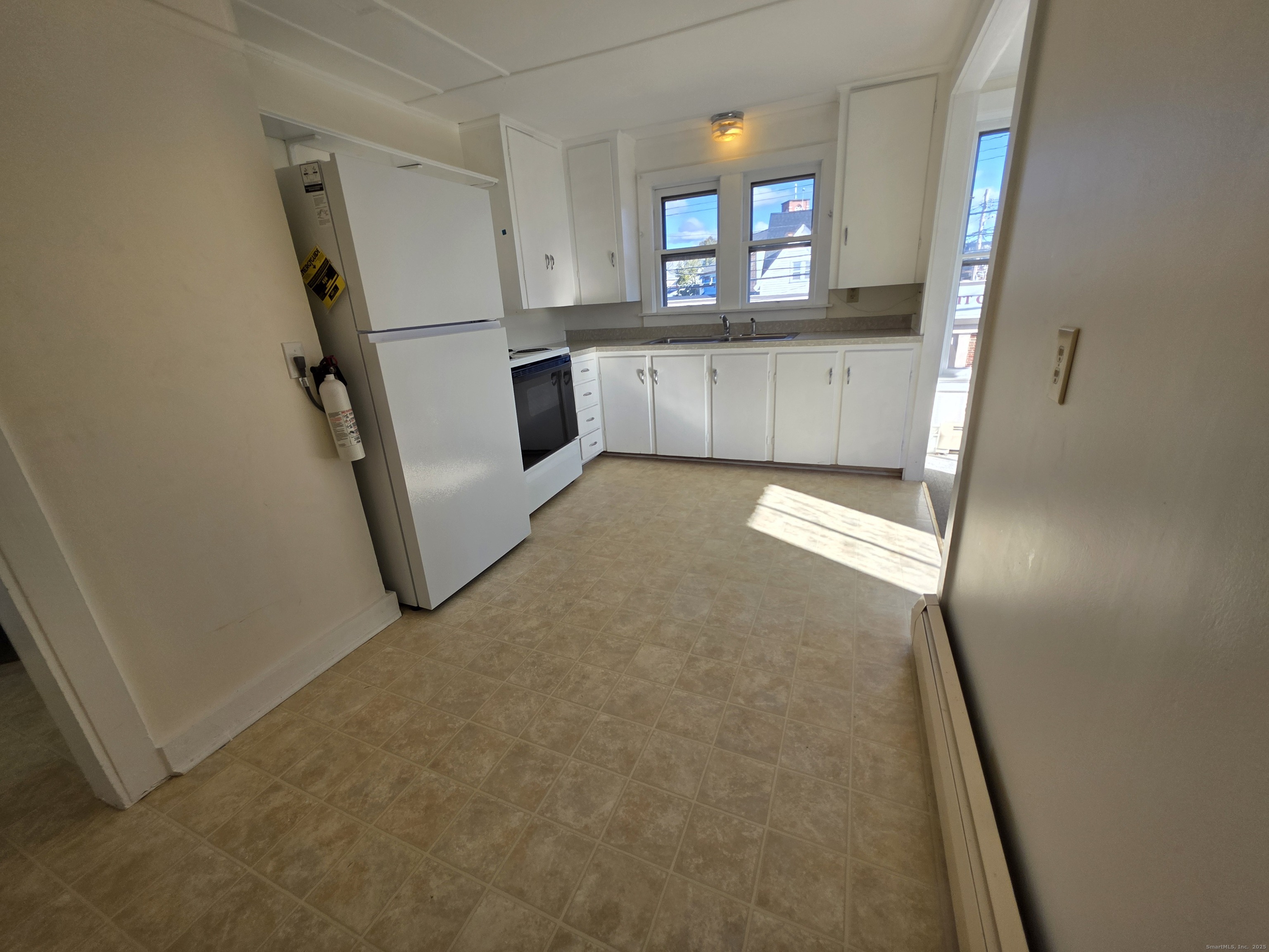 110 Main Street Griswold, CT 06351 - Photo 7 of 32 a view of a hallway to a room with window