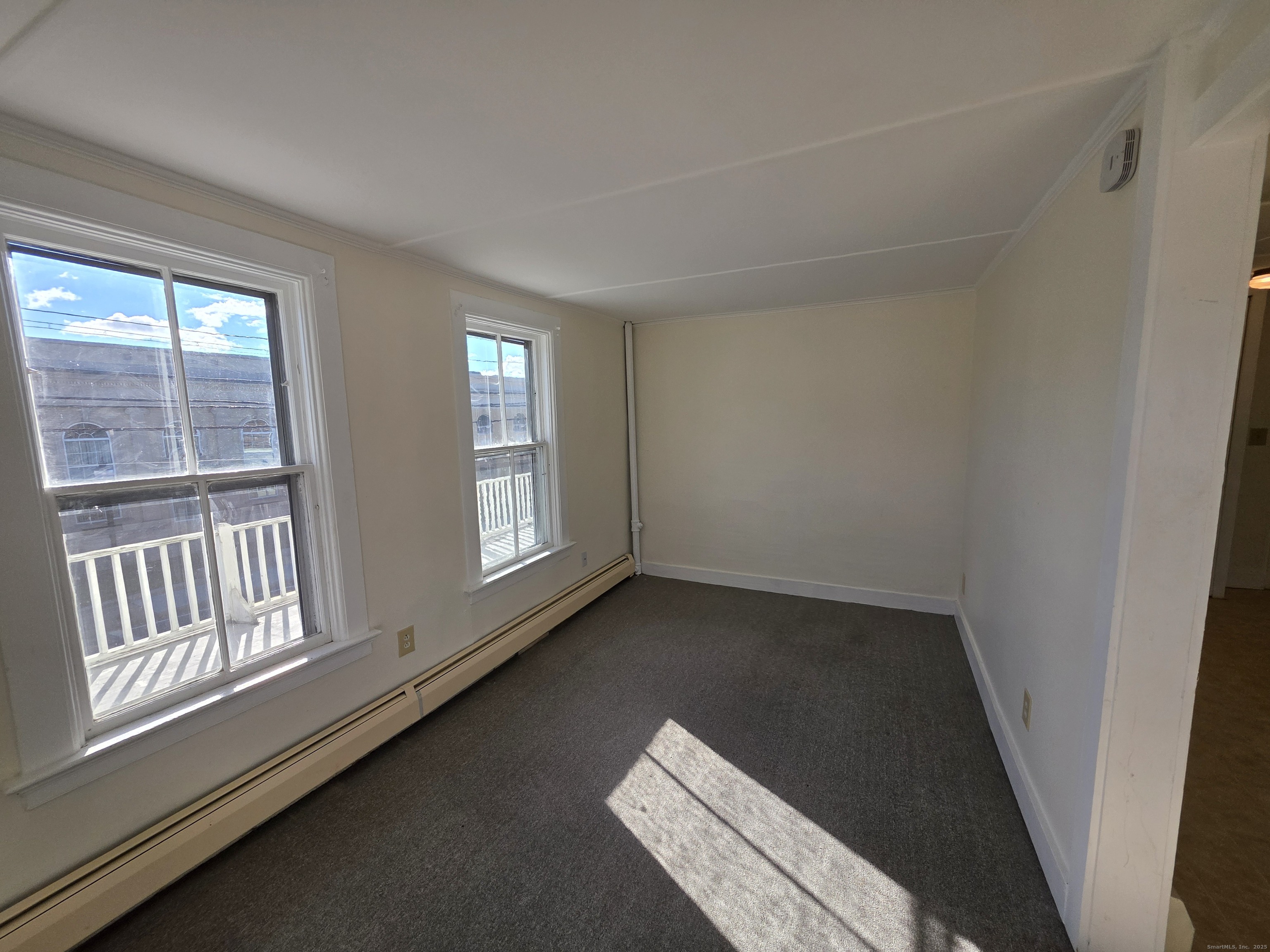 110 Main Street Griswold, CT 06351 - Photo 9 of 32 a view of an empty room and window