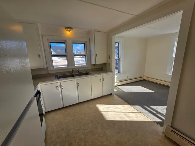 a view of a kitchen with a sink