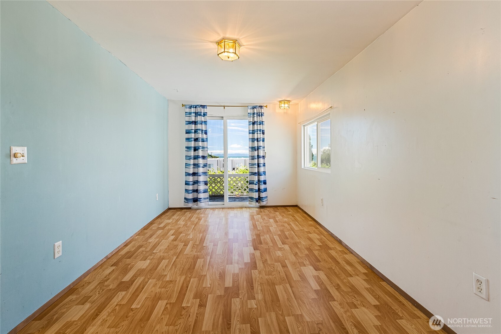 8080 Harborview Road, Unit 167 Blaine, WA 98230 - Photo 4 of 27 a view of an empty room with a window and wooden floor
