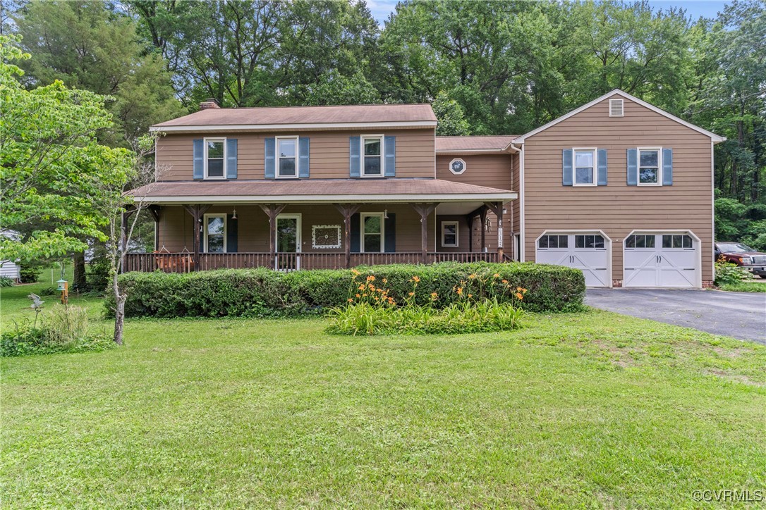 3125 Nahant Road Midlothian, VA 23112 - Photo 1 of 36 a front view of a house with a yard