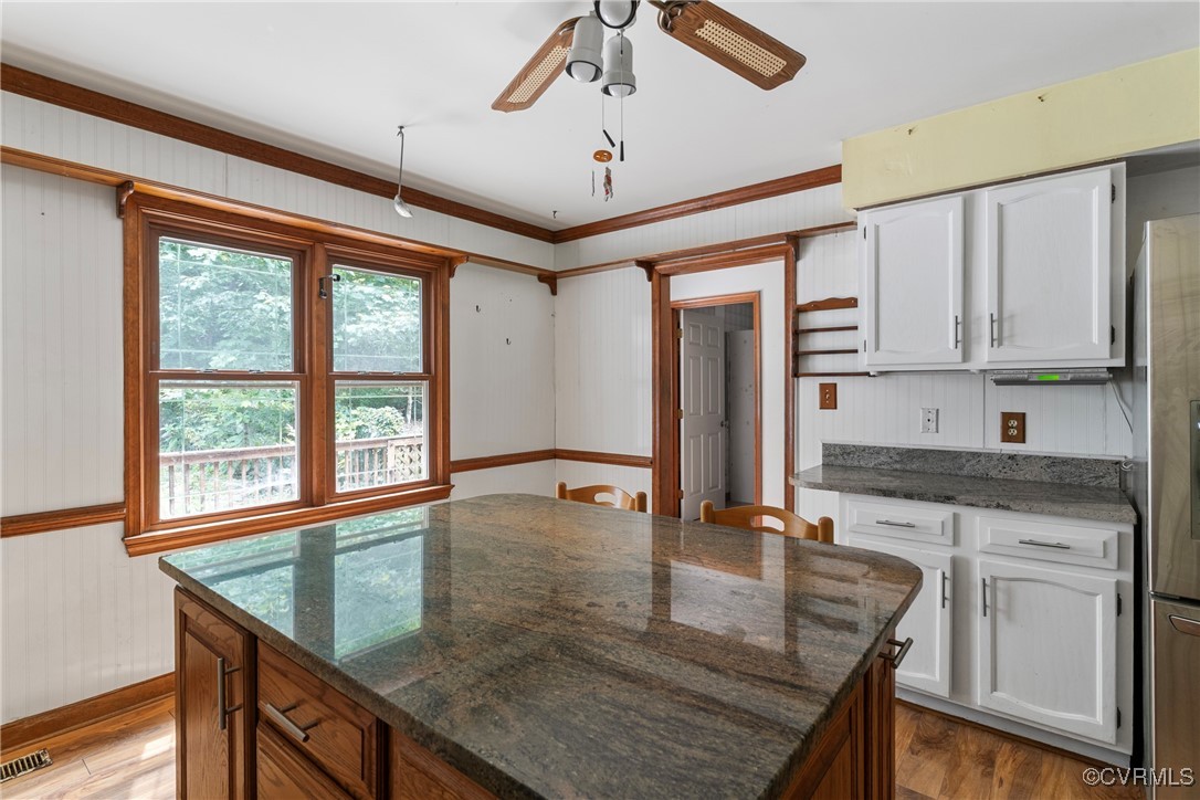 3125 Nahant Road Midlothian, VA 23112 - Photo 11 of 36 a kitchen with kitchen island granite countertop a stove a sink and a granite counter top