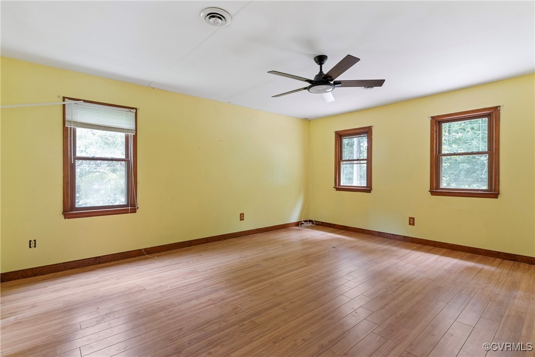3125 Nahant Road Midlothian, VA 23112 - Photo 17 of 36 a view of an empty room with wooden floor and a window