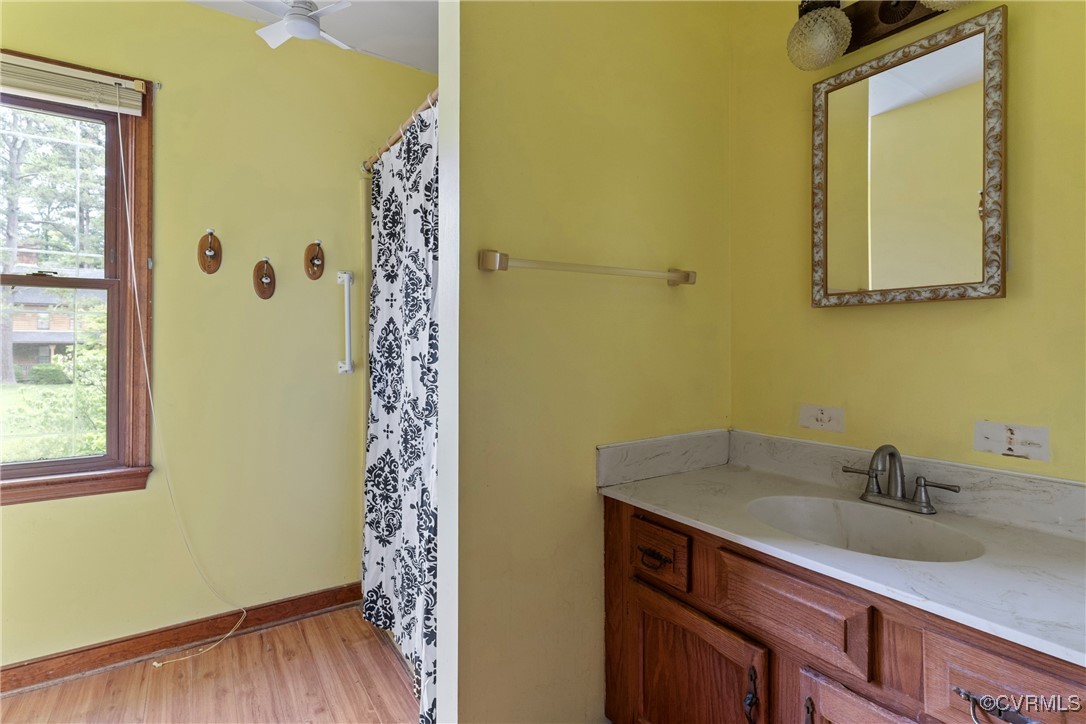 3125 Nahant Road Midlothian, VA 23112 - Photo 19 of 36 a bathroom with a sink a mirror and shower