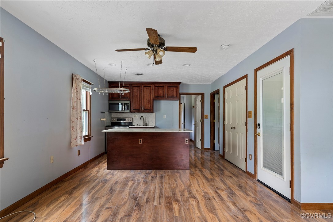 3125 Nahant Road Midlothian, VA 23112 - Photo 28 of 36 a large kitchen with stainless steel appliances granite countertop a stove and a refrigerator