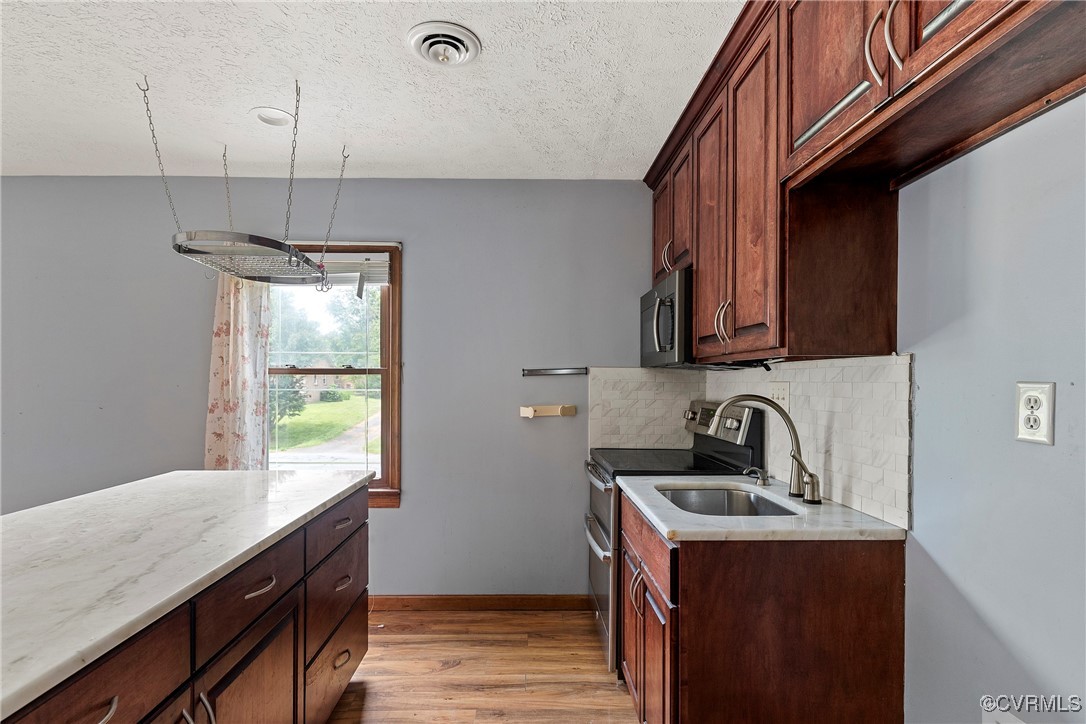 3125 Nahant Road Midlothian, VA 23112 - Photo 29 of 36 a kitchen with a sink cabinets and wooden floor
