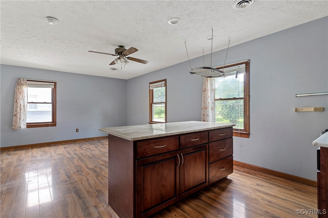 3125 Nahant Road Midlothian, VA 23112 - Photo 30 of 36 a kitchen with granite countertop a stove a sink and wooden floor