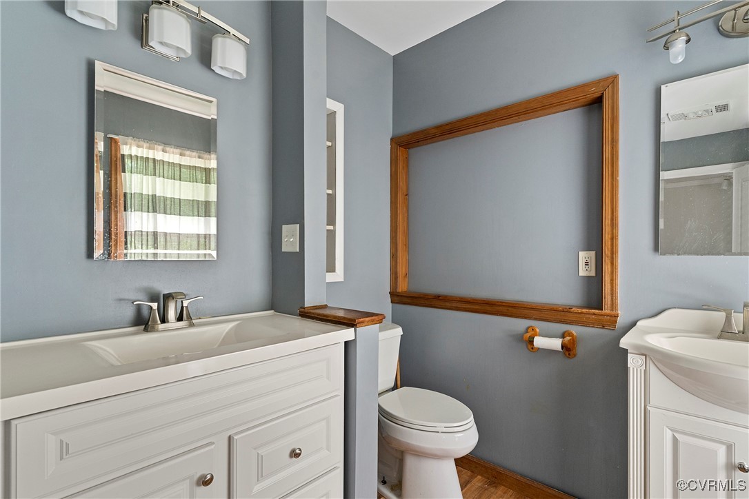 3125 Nahant Road Midlothian, VA 23112 - Photo 32 of 36 a bathroom with a sink mirror vanity and toilet