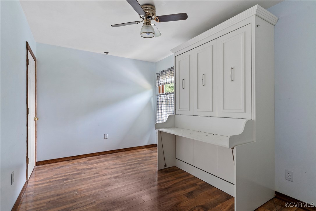 3125 Nahant Road Midlothian, VA 23112 - Photo 34 of 36 a view of an empty room with wooden floor and a ceiling fan