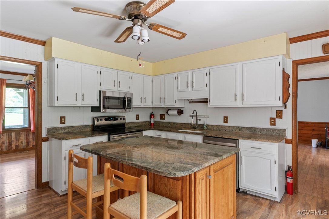 3125 Nahant Road Midlothian, VA 23112 - Photo 8 of 36 a kitchen with granite countertop a center island appliances cabinets and a counter space