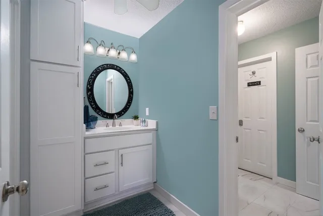 a view of a hallway a closet and utility room