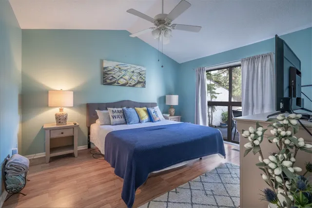 a bedroom with bed and window