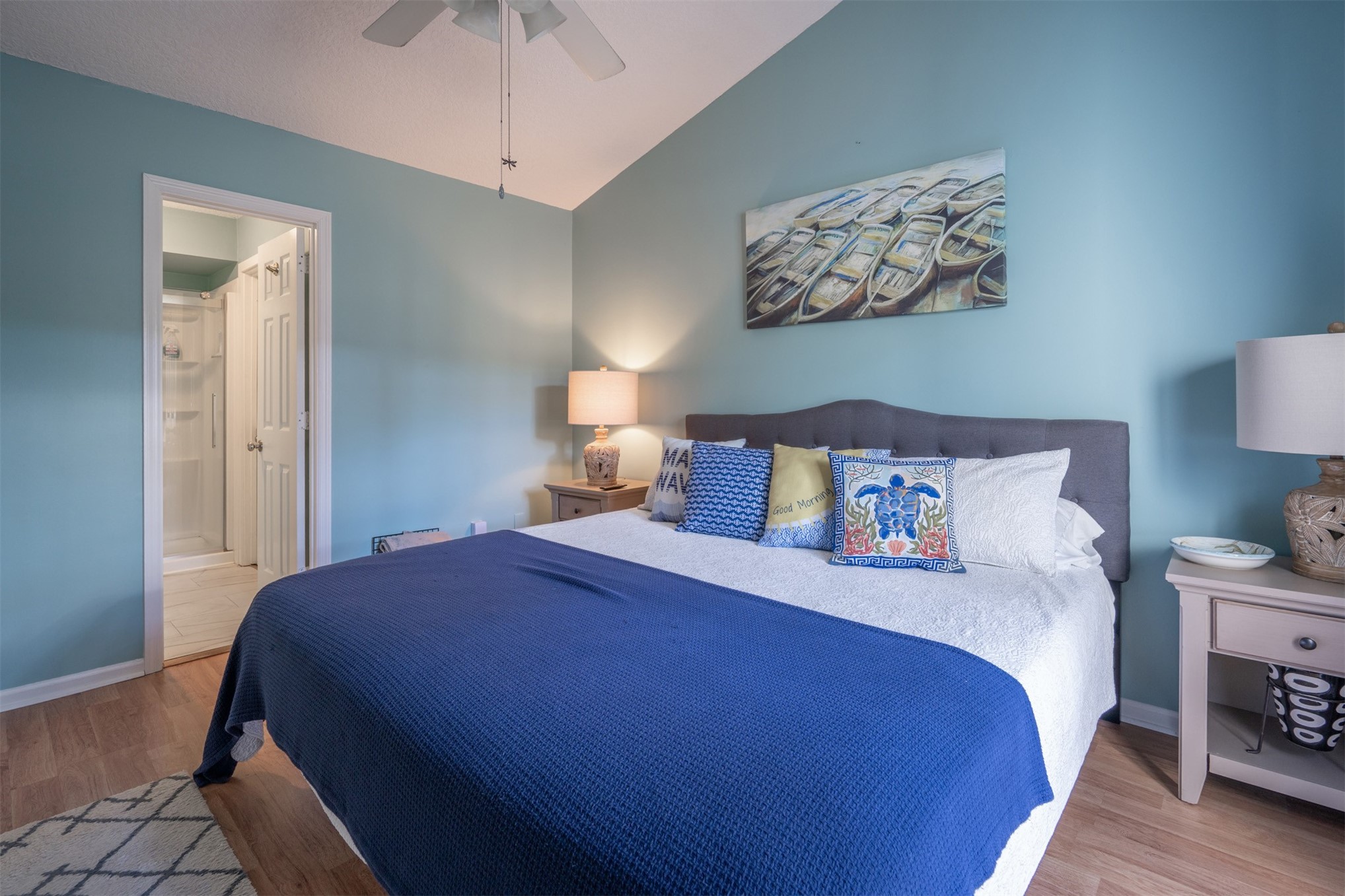 2892 Forest Ridge Drive, Unit V2 Fernandina Beach, FL 32034 - Photo 14 of 32 a bedroom with a bed and a chandelier