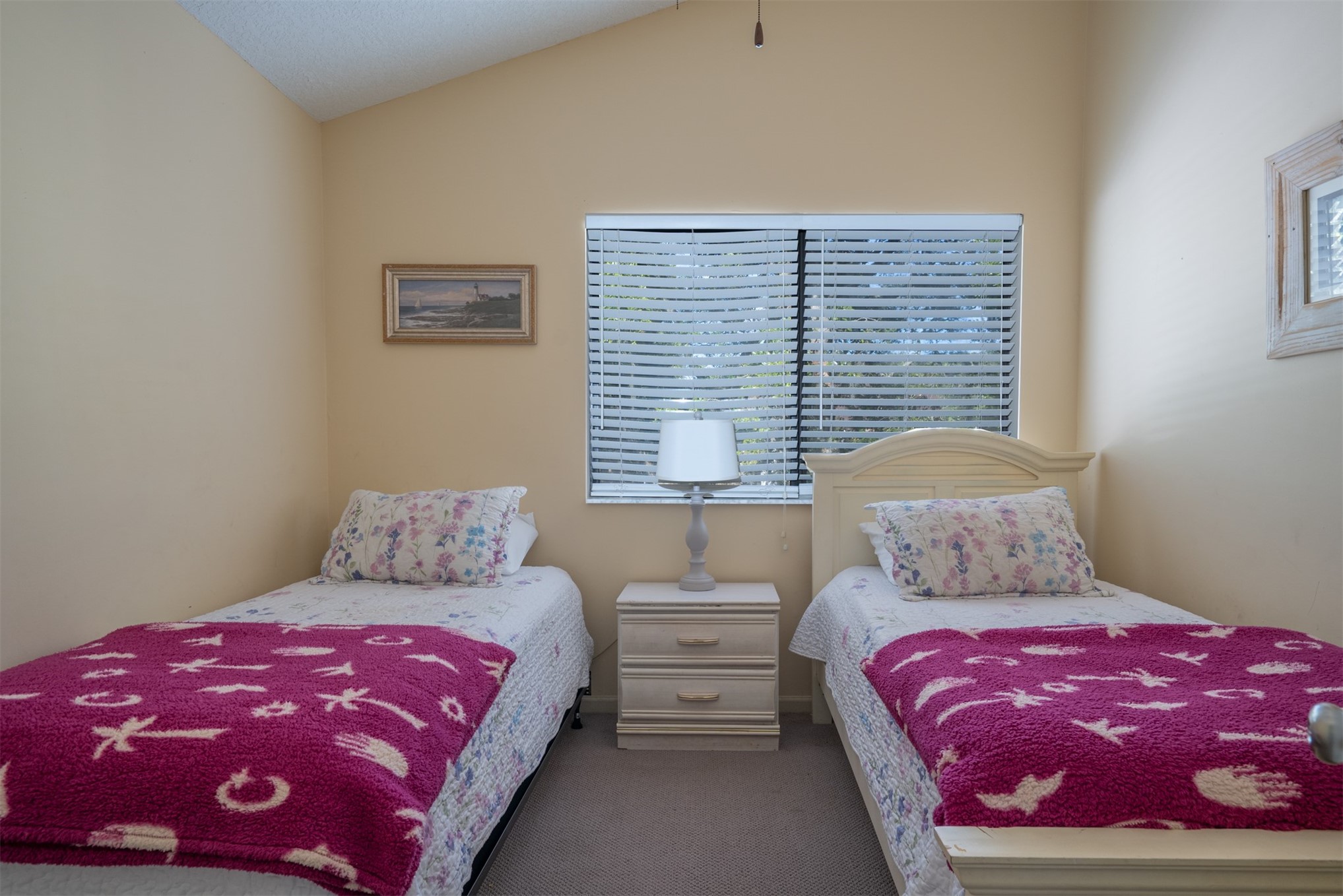2892 Forest Ridge Drive, Unit V2 Fernandina Beach, FL 32034 - Photo 19 of 32 a bedroom with a bed and a window
