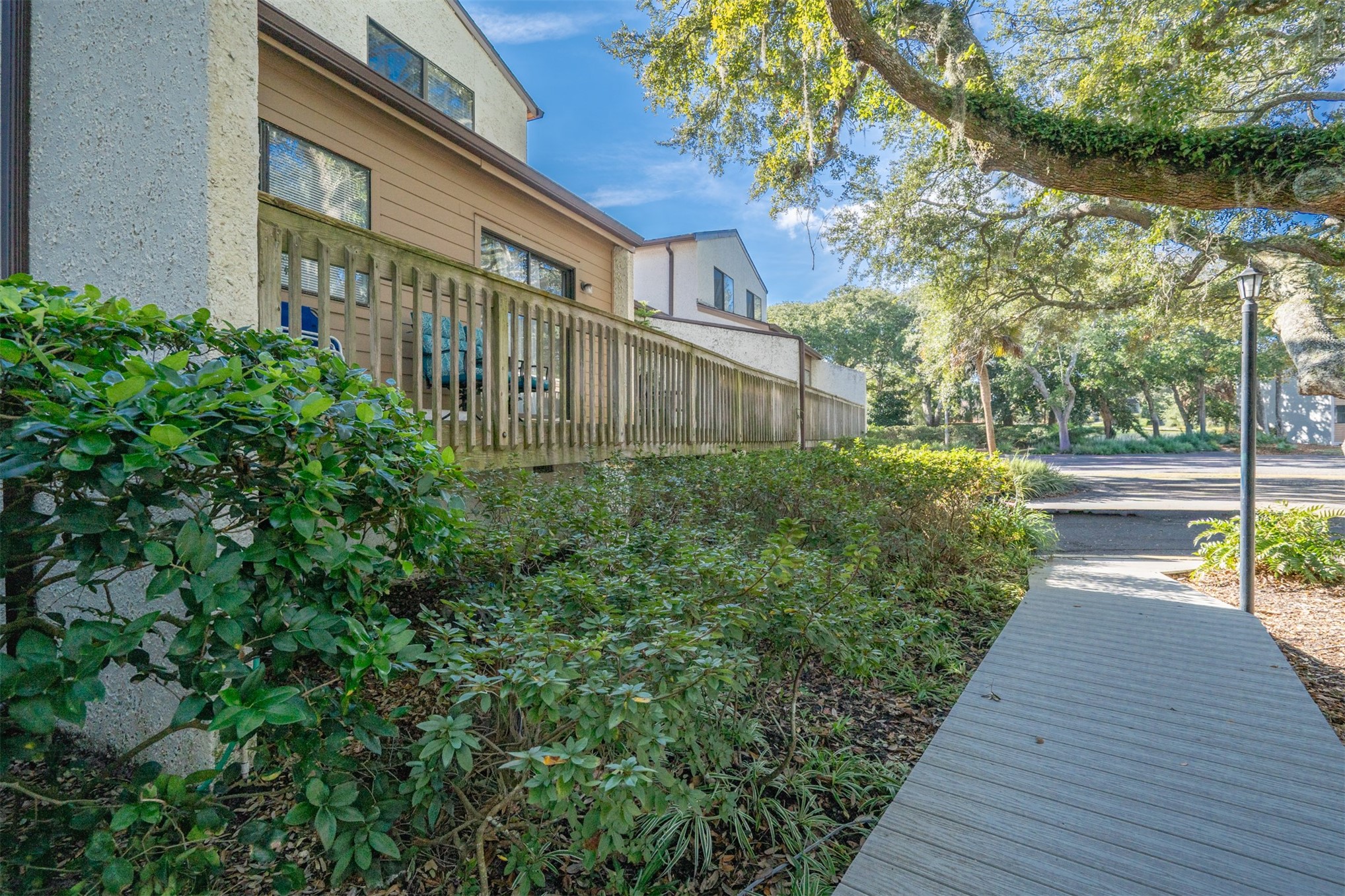 2892 Forest Ridge Drive, Unit V2 Fernandina Beach, FL 32034 - Photo 2 of 32 a view of a house with brick walls