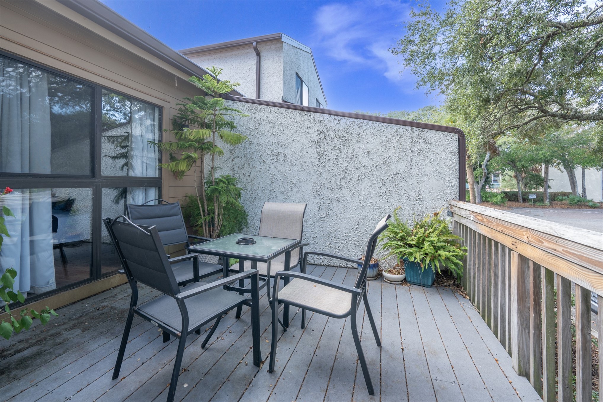 2892 Forest Ridge Drive, Unit V2 Fernandina Beach, FL 32034 - Photo 21 of 32 a view of a patio with furniture and wooden floor