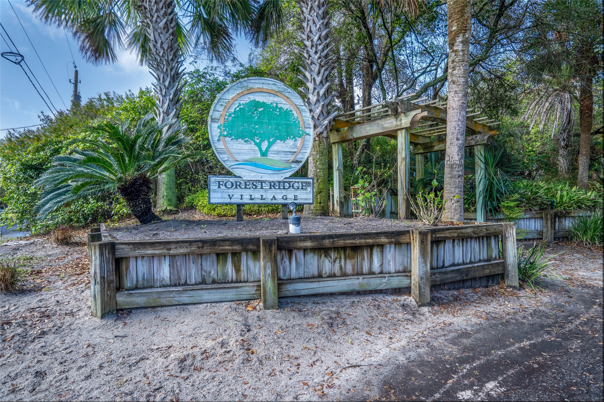 2892 Forest Ridge Drive, Unit V2 Fernandina Beach, FL 32034 - Photo 26 of 32 a view of a house with a wooden deck and a backyard