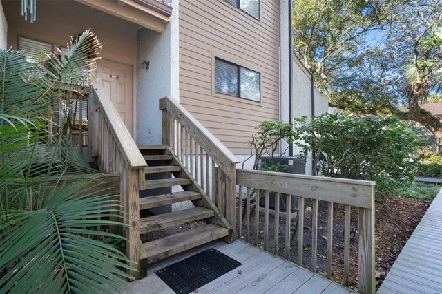 a view of a wooden deck front of house