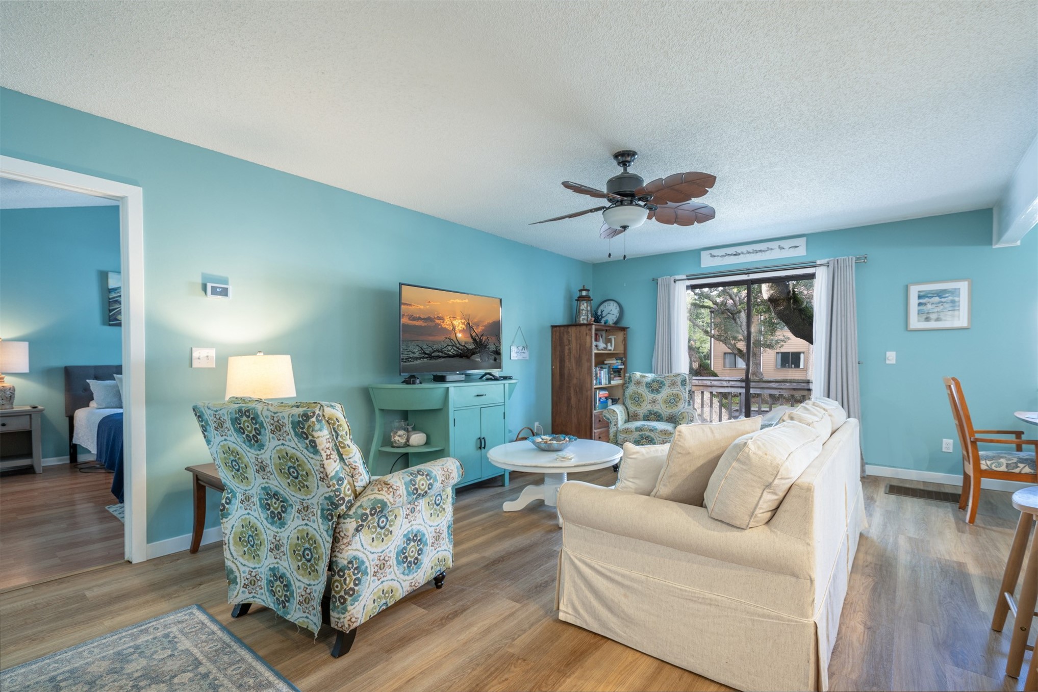 2892 Forest Ridge Drive, Unit V2 Fernandina Beach, FL 32034 - Photo 5 of 32 a living room with furniture and a flat screen tv