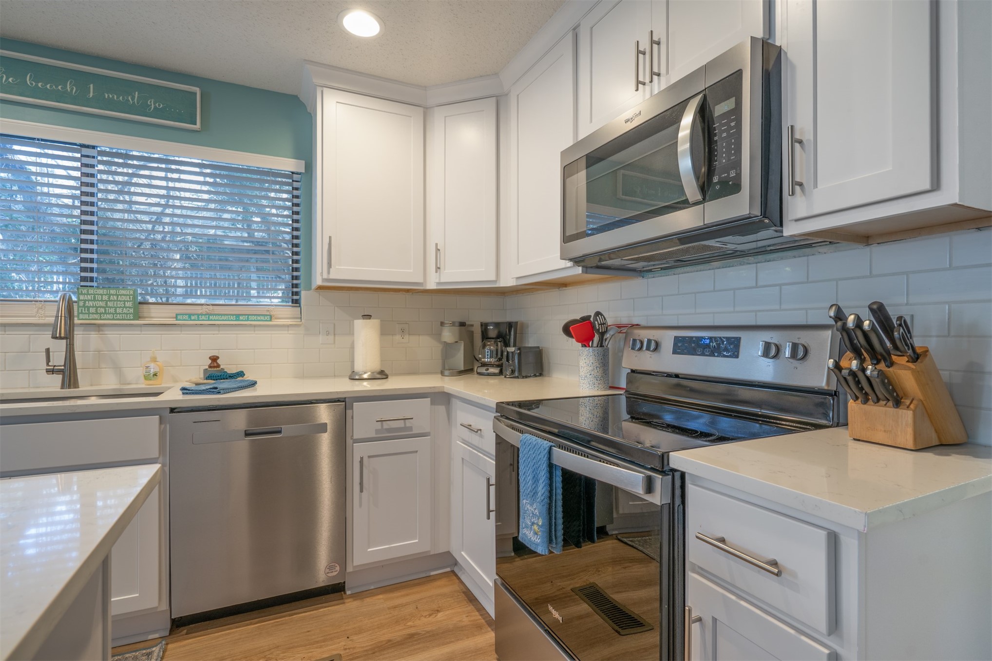 2892 Forest Ridge Drive, Unit V2 Fernandina Beach, FL 32034 - Photo 7 of 32 a kitchen with cabinets appliances and a sink