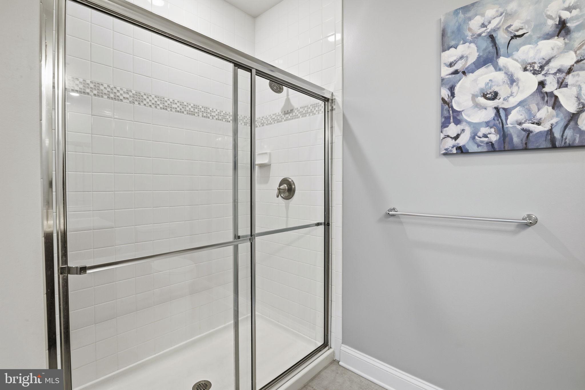 401 Bold Ruler Court, Unit 307 Havre de Grace, MD 21078 - Photo 10 of 32 Walk in shower w/ glass doors & tiled surround