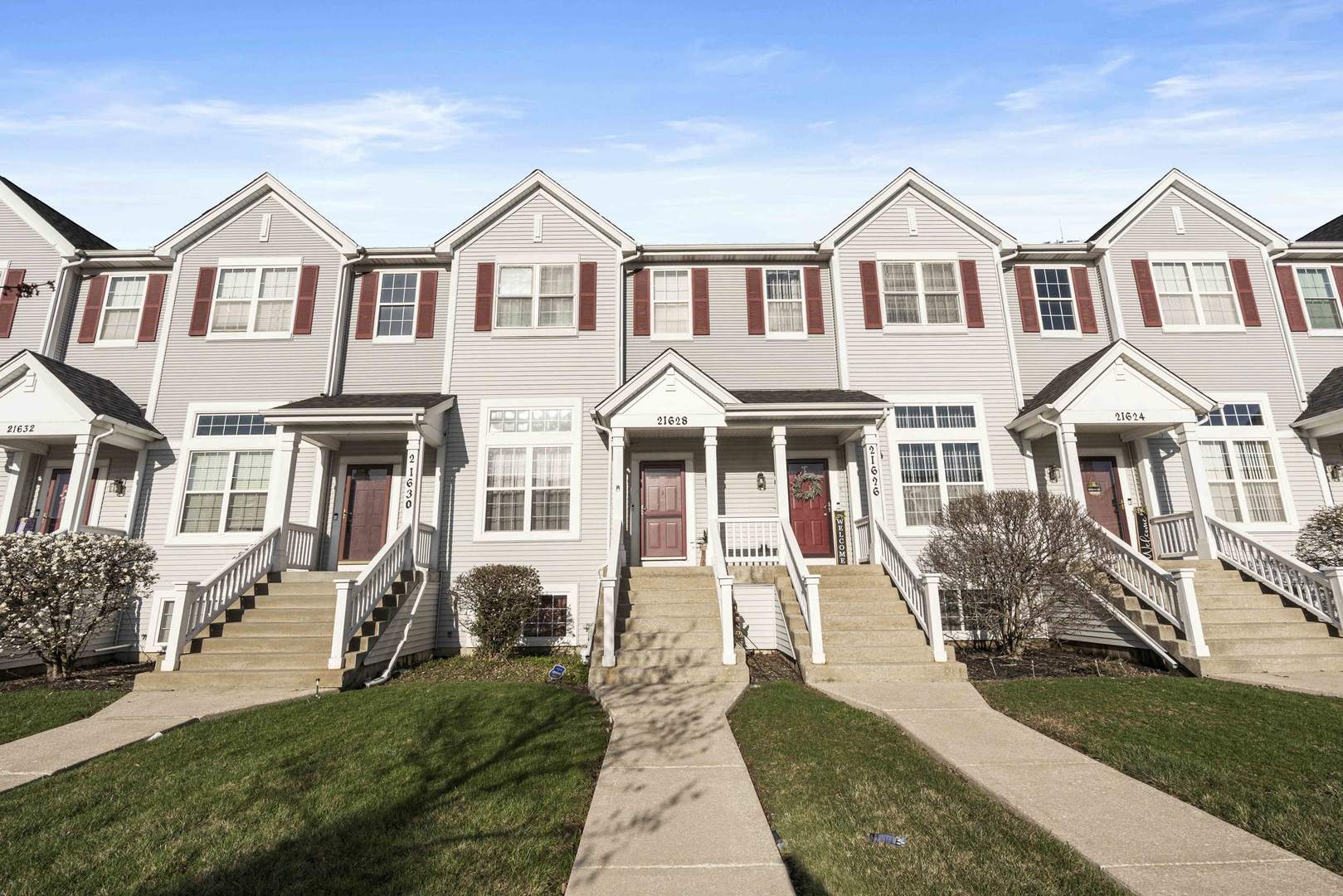 front view of a house with a yard