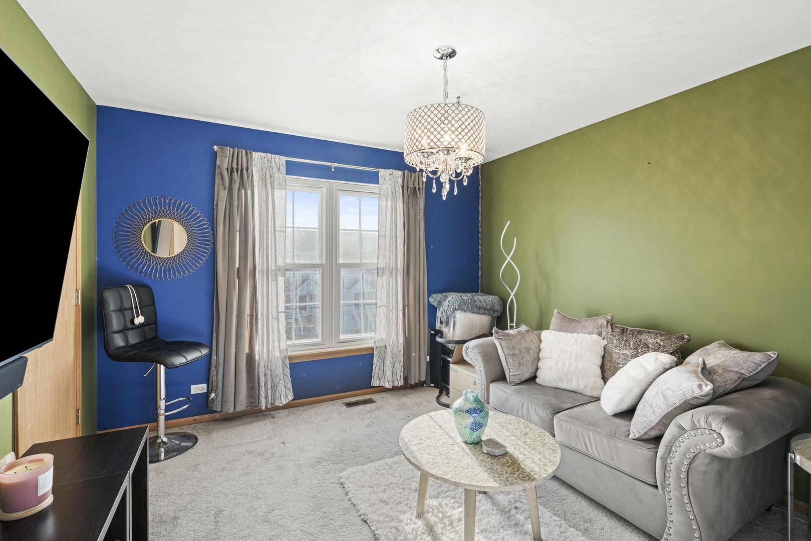 21628 Dogwood Road, Unit 1203 Matteson, IL 60443 - Photo 17 of 20 a living room with furniture a chandelier and a window