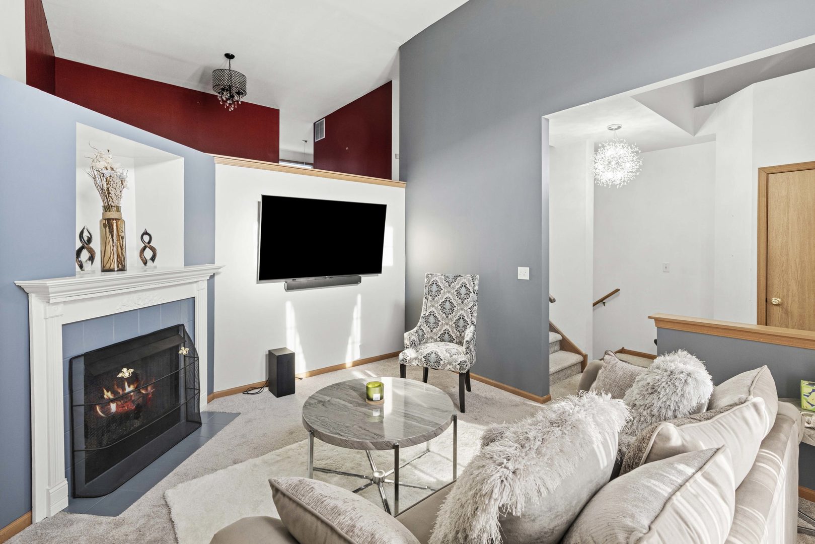 21628 Dogwood Road, Unit 1203 Matteson, IL 60443 - Photo 6 of 20 a living room with furniture a flat screen tv and a fireplace