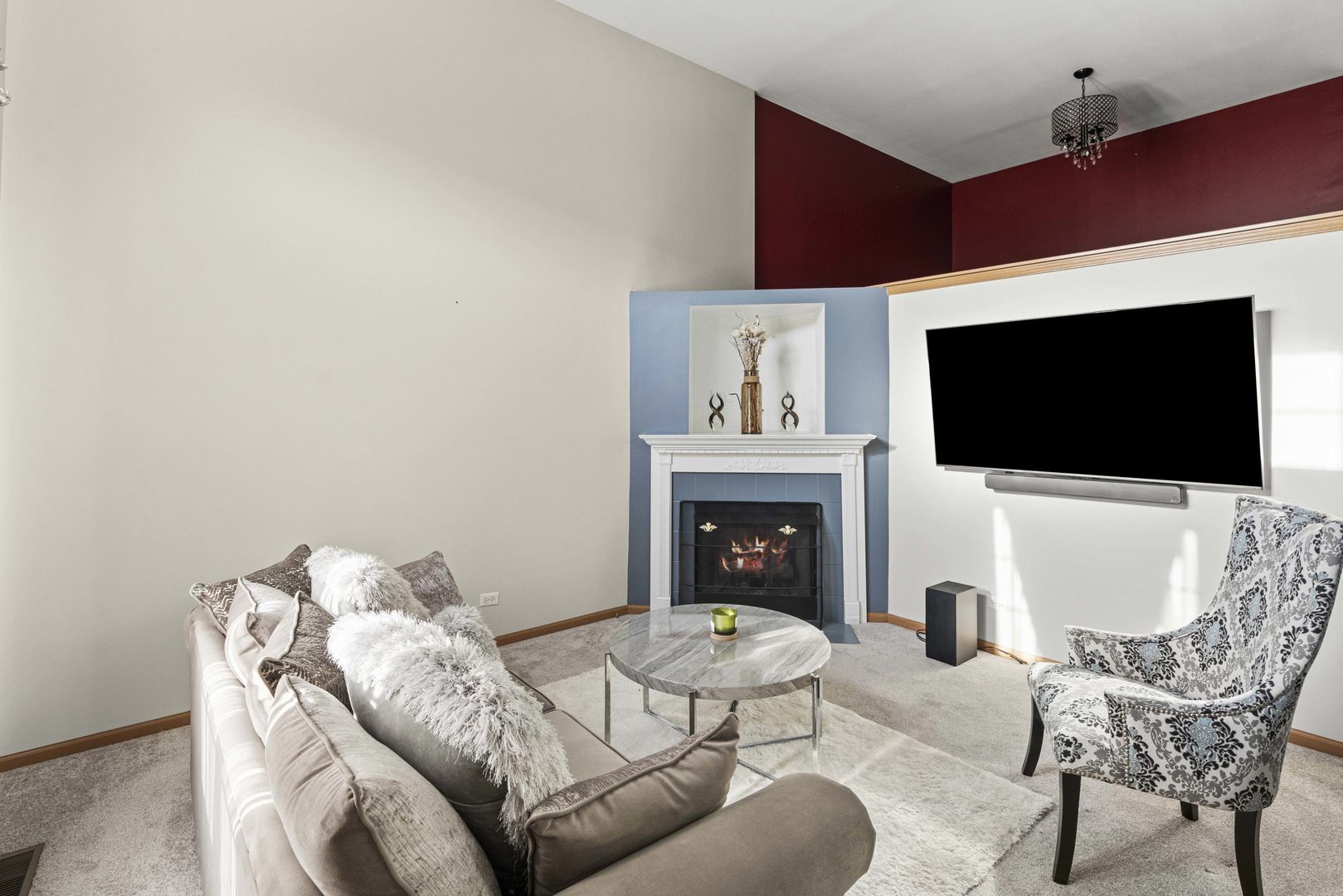 21628 Dogwood Road, Unit 1203 Matteson, IL 60443 - Photo 7 of 20 a living room with furniture a flat screen tv and a fireplace