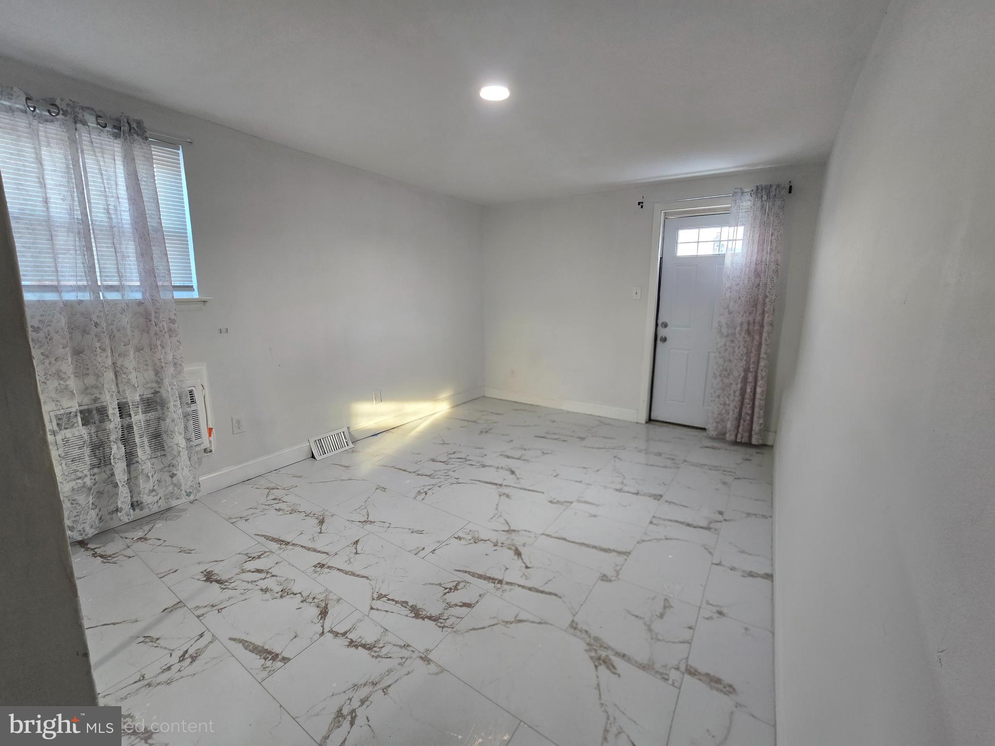2118 Benson Street Philadelphia, PA 19152 - Photo 22 of 26 a view of an empty room and window