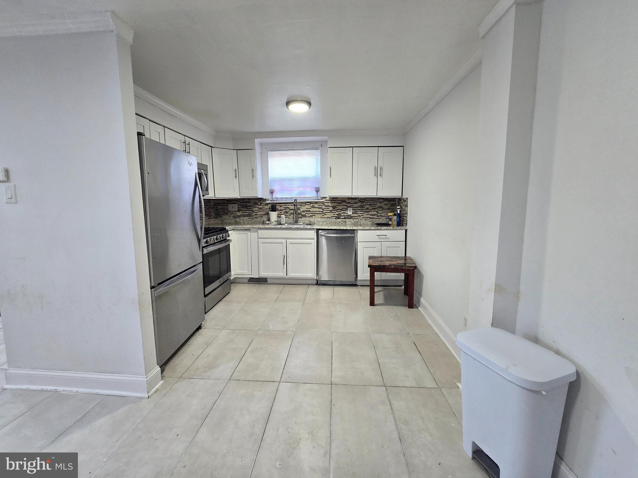 2118 Benson Street Philadelphia, PA 19152 - Photo 10 of 26 a kitchen with stainless steel appliances granite countertop a refrigerator and a stove top oven