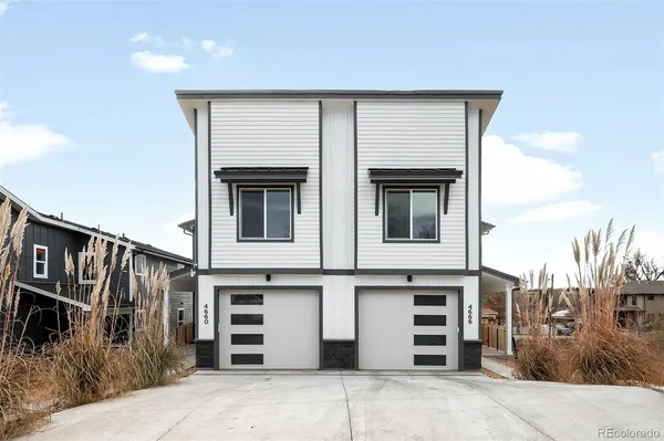 a front view of a house with a garage