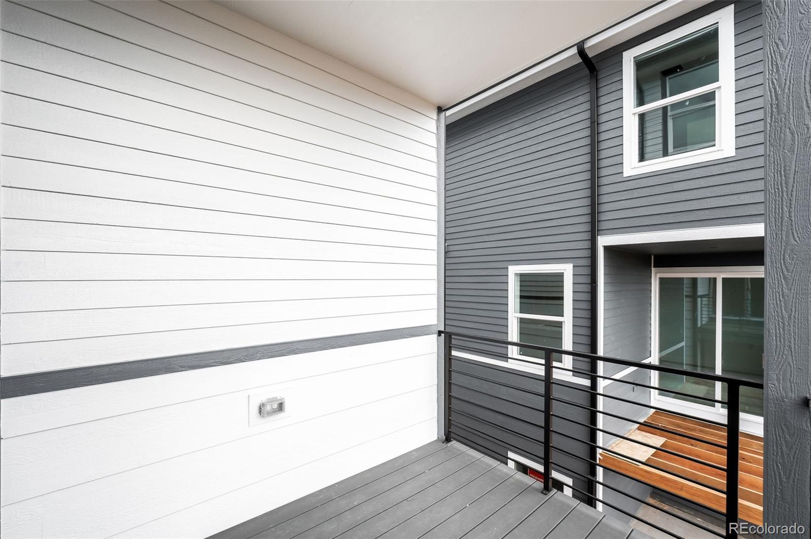 4660 West 9th Avenue Denver, CO 80204 - Photo 11 of 35 a view of a balcony with wooden floor and cabinet