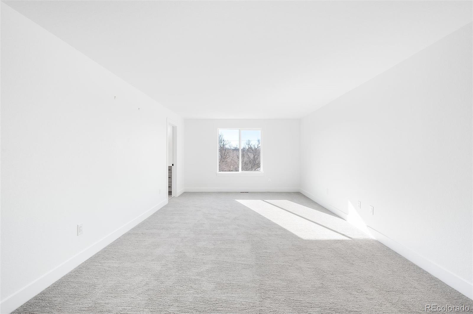 4660 West 9th Avenue Denver, CO 80204 - Photo 13 of 35 a view of an empty room with a window