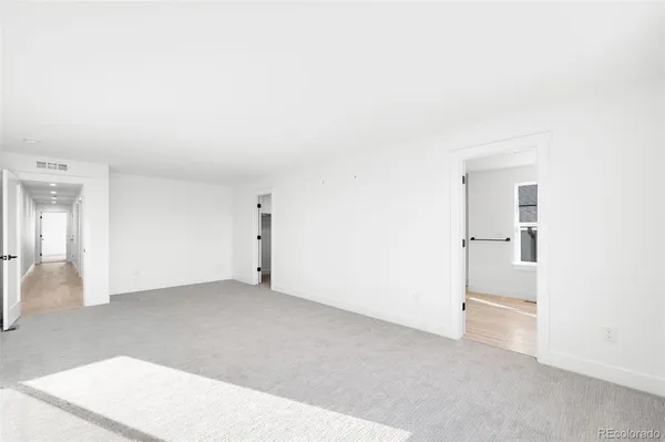 a bathroom with double vanity a sink a mirror a vanity and a window