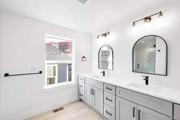 a bathroom with a shower and a glass door