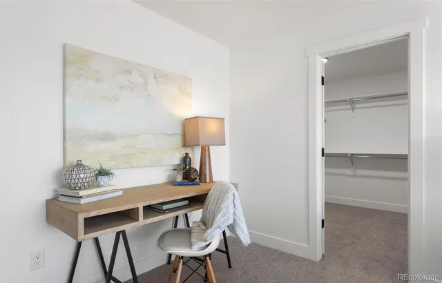 a view of a workspace with furniture