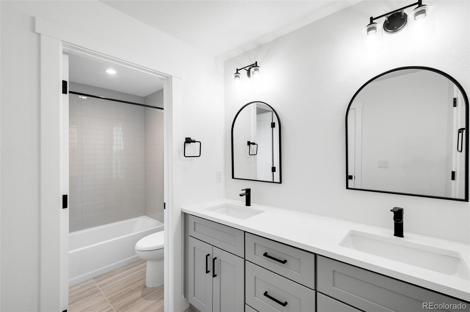4660 West 9th Avenue Denver, CO 80204 - Photo 20 of 35 a bathroom with a sink and a mirror