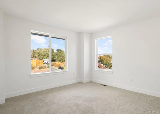 an empty room with windows