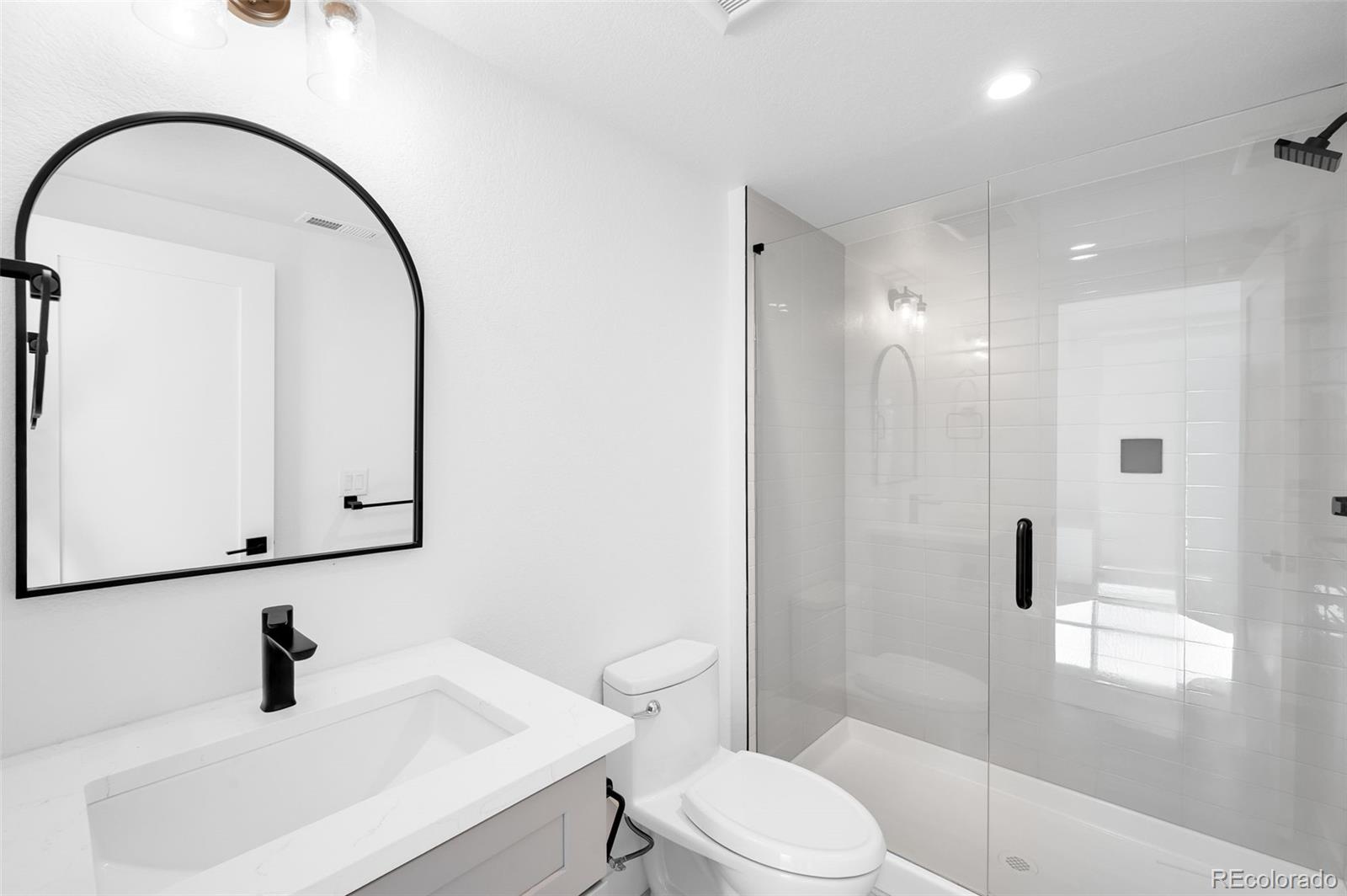 4660 West 9th Avenue Denver, CO 80204 - Photo 27 of 35 a bathroom with a sink toilet and shower