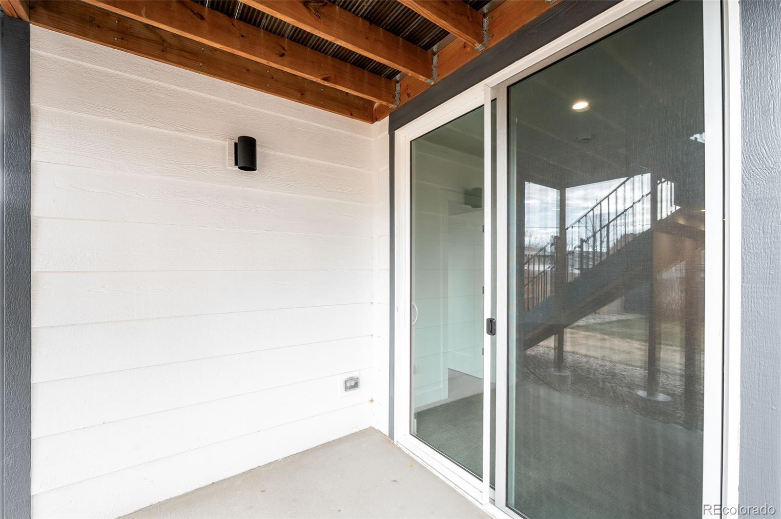 4660 West 9th Avenue Denver, CO 80204 - Photo 30 of 35 a bathroom with a glass shower door