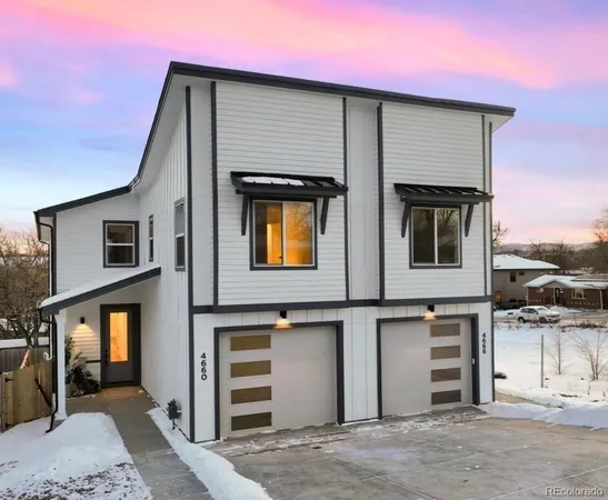 a front view of a house with a garage