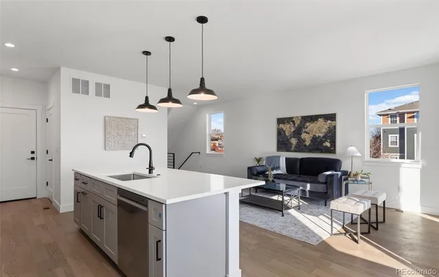a view of living room and kitchen with furniture