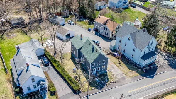 an aerial view of residential houses with outdoor space